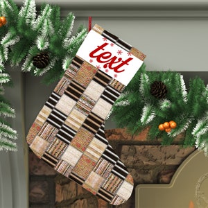 May include: A Christmas stocking with a patchwork design in black, white and brown. The stocking has a white cuff with the word "text" in red.