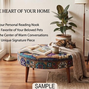 a cozy living room with a round ottoman, a cat sleeping on it, a potted plant, and a book. The room has a warm and inviting atmosphere, with a rug on the floor and a lamp providing soft lighting.