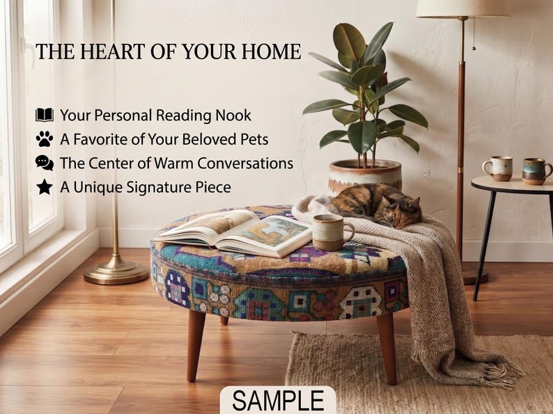 a cozy living room with a round ottoman, a cat sleeping on it, a potted plant, and a book. The room has a warm and inviting atmosphere, with a rug on the floor and a lamp providing soft lighting.