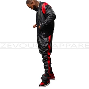 May include: Black leather jacket and pants set with red accents. The jacket has red shoulder panels, and the pants feature a red stripe down the side. The outfit is paired with red and black sneakers. The text "ZEVOU APPAREL" is visible.