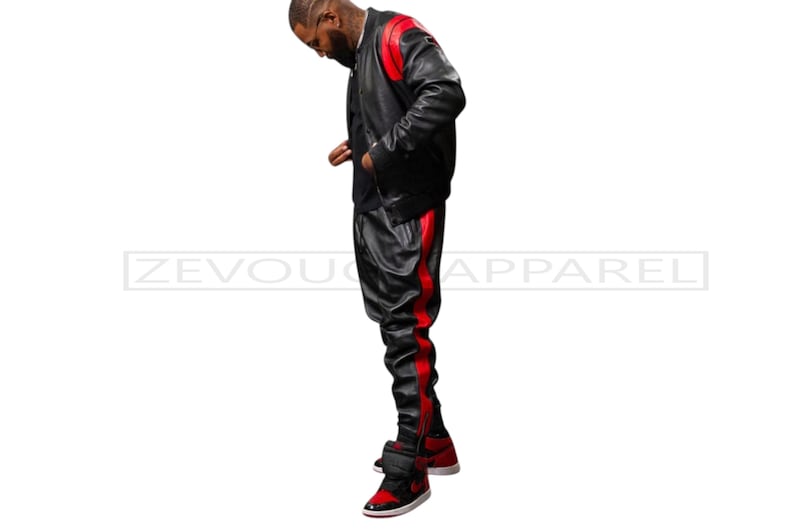 May include: Black leather jacket and pants set with red accents. The jacket has red shoulder panels, and the pants feature a red stripe down the side. The outfit is paired with red and black sneakers. The text "ZEVOU APPAREL" is visible.