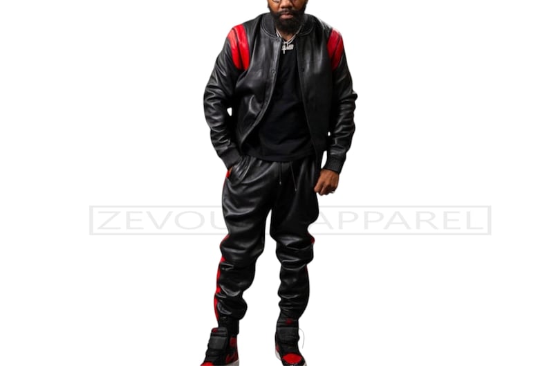 May include: Black leather bomber jacket with red shoulder accents and matching black leather pants with red side stripes. The outfit is paired with red and black sneakers. The text "ZEVOU APPAREL" is visible.