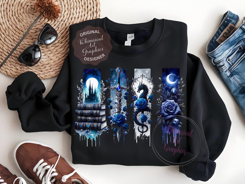 May include: Black sweatshirt featuring four vertical fantasy art panels with a castle, sword, dragon, and moon, all in shades of blue. The design includes blue roses and the text "Original Whimsical Art Graphics Designer".