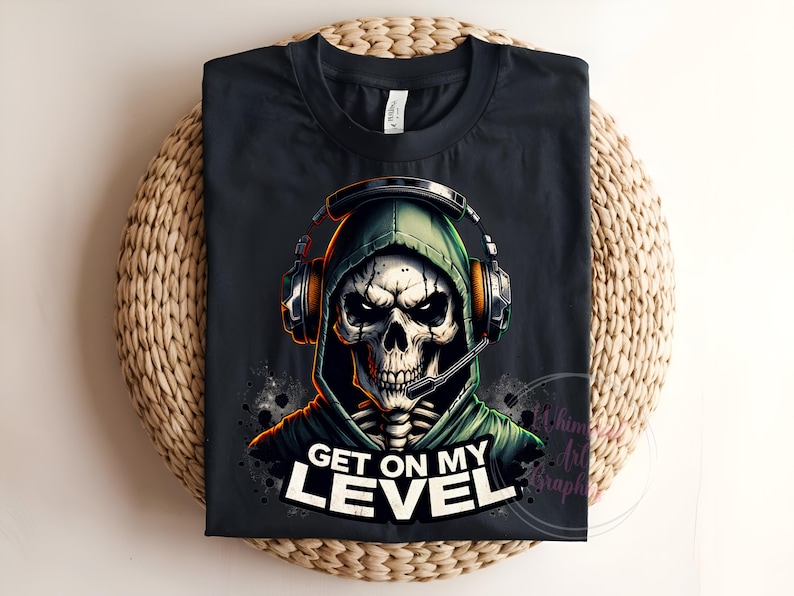 May include: Black t-shirt with a graphic of a skeleton wearing a green hooded sweatshirt and headphones. The text "Get on my level" is printed below the graphic.