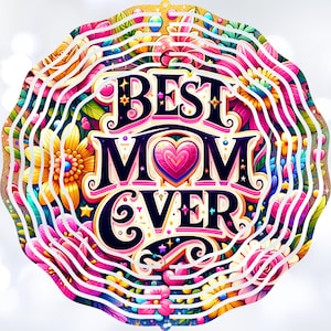 May include: A colorful, circular design with the words "BEST MOM EVER" in a stylized font. The design is surrounded by a ring of flowers and swirls.