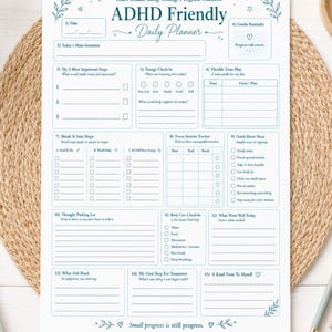 Peut inclure: Une feuille de planning quotidien blanche avec du texte et des illustrations en bleu. L'en-tête indique ADHD Friendly Daily Planner. Les sections incluent la date, l'intention, les étapes, l'énergie, le planning, le suivi et les notes.