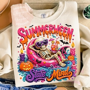 May include: A cream-coloured sweatshirt with a vibrant "Summerween State of Mind" graphic. The design showcases a skeleton in sunglasses, lounging on a pink float, holding a cocktail, and surrounded by Halloween-themed elements.