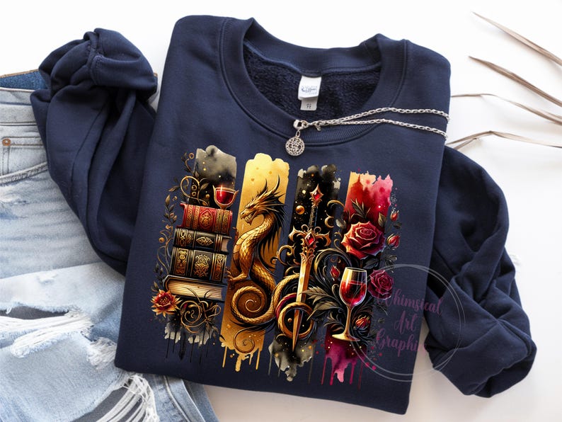 May include: A navy blue sweatshirt with a graphic print of a dragon, a sword, a wine glass, and a stack of books. The graphic is in shades of gold, red, and black.