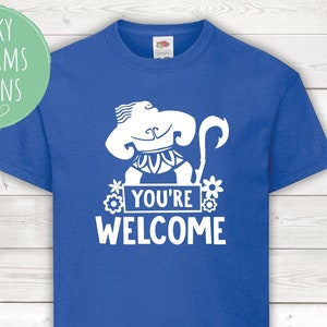 May include: A royal blue t-shirt with a white graphic of a cartoon character with a hook, flowers, and the text "You're Welcome".