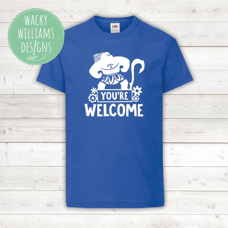 May include: A royal blue t-shirt with a white graphic of a cartoon character with a hook, flowers, and the text "You're Welcome".
