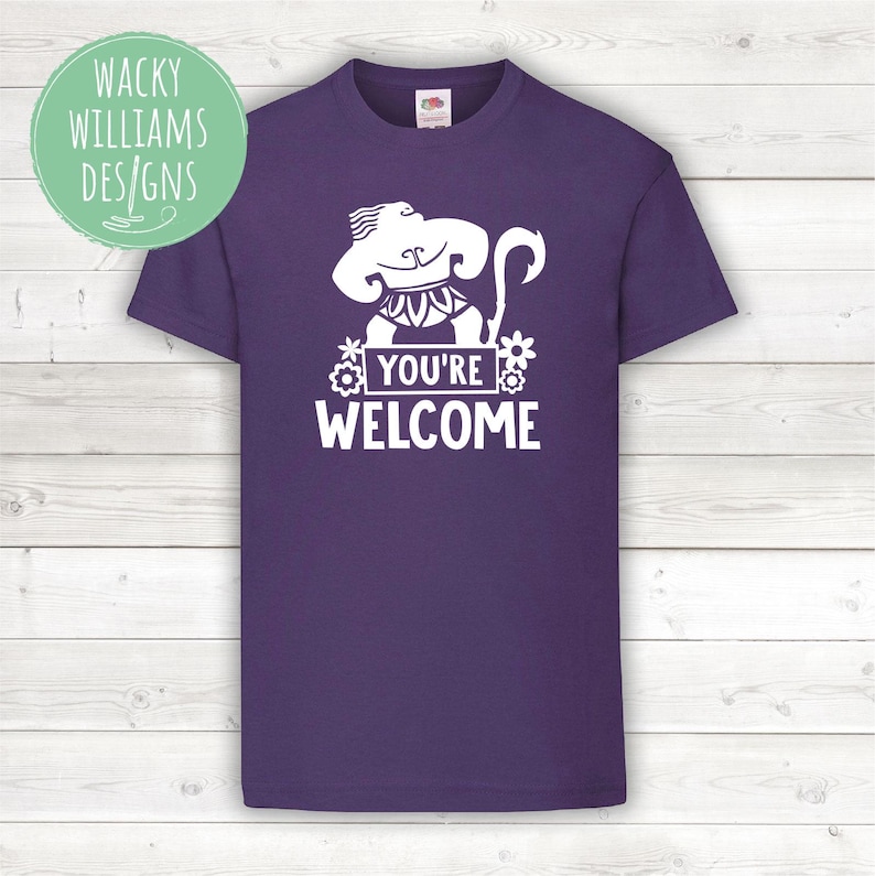 May include: Purple t-shirt with a white graphic of a cartoon character with the text "You're Welcome".