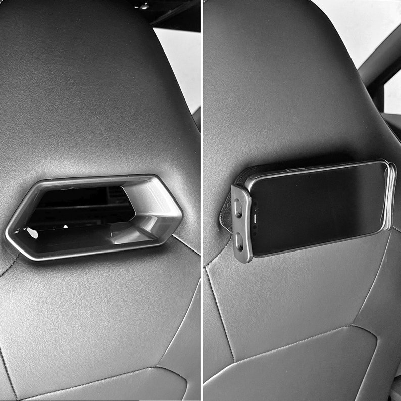 May include: Two close-up images of a car seat with a phone holder. The first image shows a black plastic phone holder with a phone in it. The second image shows an empty phone holder.