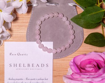Rose Quartz - Handcrafted beaded  bracelet made with 8mm crystal beads on stretch fit elastic.