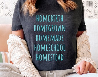 May include: A dark gray t-shirt with the words "Homebirth", "Homegrown", "Homemade", "Homeschool", and "Homestead" printed in light blue.