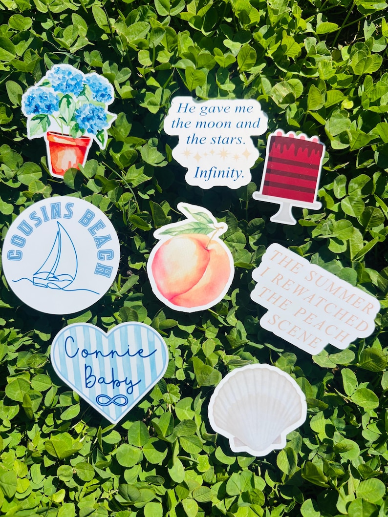 May include: A collection of stickers with various designs, including a sailboat, a peach, a seashell, a cake, and a pot of blue flowers. Some stickers have text: "Cousins Beach", "Connie Baby", "He gave me the moon and the stars. Infinity.", and "The Summer I Rewatched The Peach Scene."