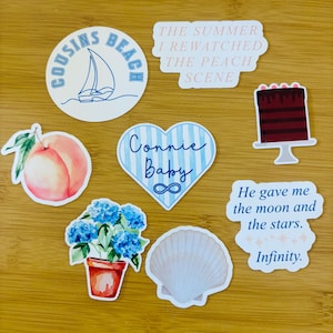 May include: A collection of stickers with various designs. Includes a sailboat, a peach, a cake, a seashell, a heart with text, and a flower pot. Text includes "Cousins Beach", "The Summer I Rewatched The Peach Scene", "Connie Baby", and "He gave me the moon and the stars. Infinity."