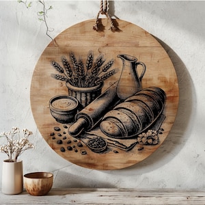 Puede incluir: Un letrero redondo de madera con una ilustración en blanco y negro de un rodillo, pan, una jarra y espigas de trigo. El letrero está colgado de una cuerda.