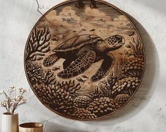 May include: A round wooden wall decor featuring a black and white illustration of a sea turtle swimming in a coral reef. The turtle is surrounded by coral and fish.
