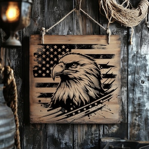 May include: A wooden sign with a distressed finish featuring a black and white illustration of an eagle with its wings spread, superimposed over an American flag.