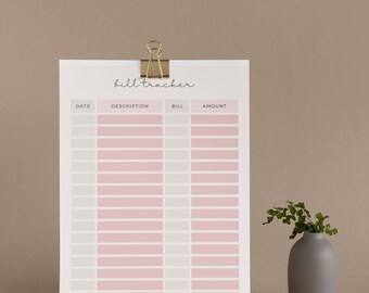 May include: A printable bill tracker with columns for date, description, bill, and amount. The tracker is printed on white paper and has a gold binder clip at the top.