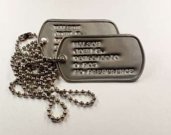 Personalised debossed dogs tag pair made one an original Vietnam era dog tag machine