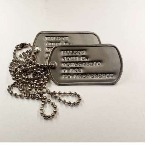 Personalised debossed dogs tag pair made one an original Vietnam era dog tag machine