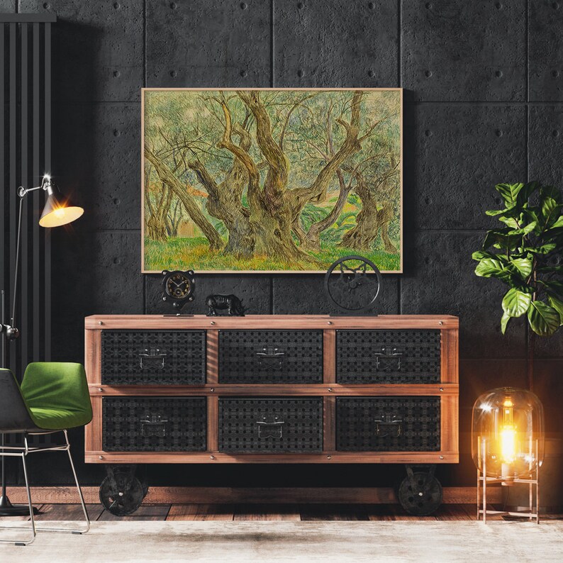 May include: A framed painting of a grove of olive trees with thick trunks and branches, set against a dark grey wall with a wooden dresser and a lamp in the foreground.