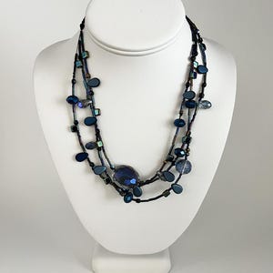 blue 3-strand multi glass bead necklace on black