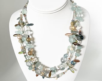 Sea Change -- Light 3-strand glass, ceramic, and shell necklace