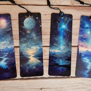 May include: Set of four bookmarks featuring a fantasy landscape with a river, mountains, and a starry sky. Each bookmark has a different celestial object, including a planet, a star, and a comet.