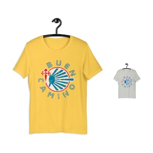 May include: Yellow t-shirt with a blue and red graphic of a scallop shell and the text "Buen Camino".