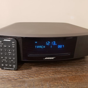 Bose wave radio IV music system cd/am/fm/alarm/aux w/remote, power cord.