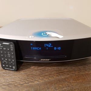 Bose wave radio IV music system  Titanium silver cd/am/fm/alarm/aux w/remote, power cord