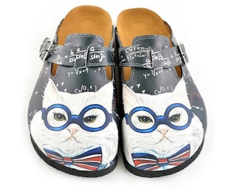May include: A pair of black clogs with a white cat face wearing blue glasses and a bow tie. The clogs have a buckle strap and a brown insole. The upper part of the clogs has mathematical equations written on them.