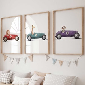 May include: A wooden storage bench with six white bins, a light gray woven rug, and three framed prints of animals driving cars. The prints feature a lion in a red car, a giraffe in a teal car, and a monkey in a purple car.
