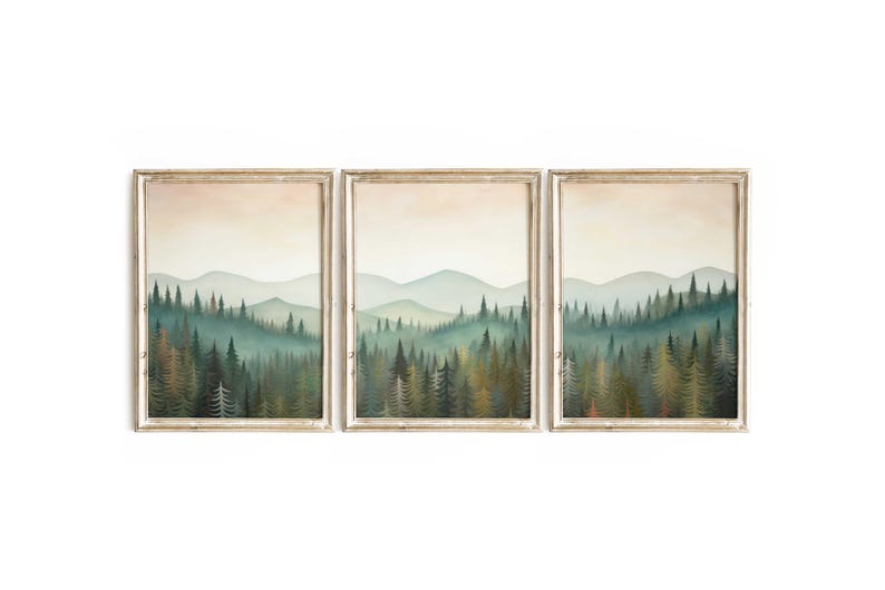 May include: A set of three framed prints depicting a misty forest scene with a row of evergreen trees in the foreground and a hazy mountain range in the background.