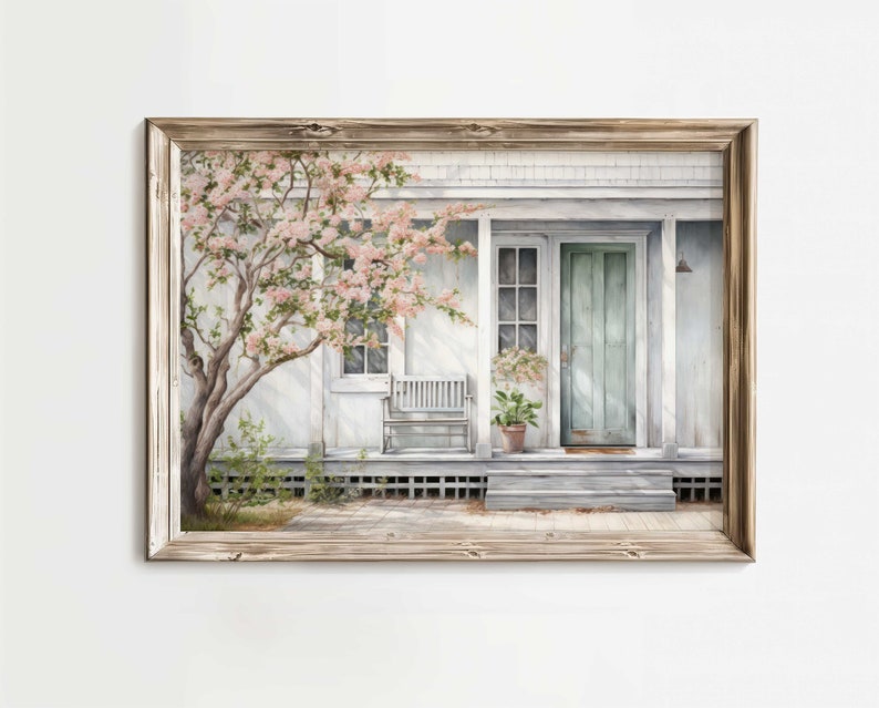 K&ouml;nnte beinhalten: Ein Aquarellbild eines wei&szlig;en Hauses mit einer hellblauen T&uuml;r und einer Veranda mit einer wei&szlig;en Bank. Ein rosa bl&uuml;hender Baum steht im Vorgarten.