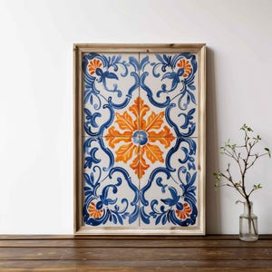 May include: A framed wall art piece featuring a blue and orange floral tile pattern. The tile design is reminiscent of traditional Portuguese or Spanish tiles.