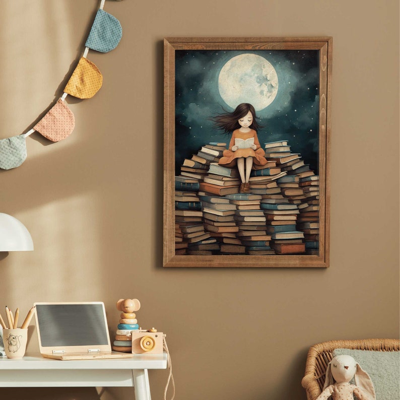 May include: A framed illustration of a girl sitting on a large pile of books, reading a book under a full moon. The girl is wearing a yellow dress and has long brown hair. The background is a dark blue sky with stars.