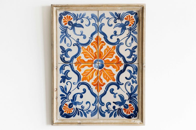 May include: A framed wall art piece featuring a blue and orange floral pattern on a white background. The frame is a light wood colour.