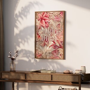 May include: A framed print with a floral design in shades of pink and cream. The print features the Latin phrase "Carpe Diem" in a stylized font.