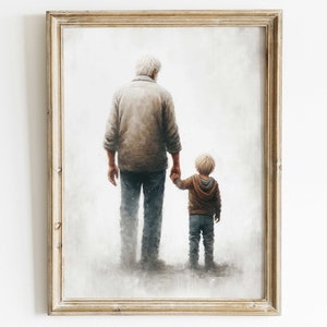 Op de afbeelding: Een ingelijst schilderij van een oudere man en een jonge jongen die hand in hand lopen. De man draagt een beige trui en een blauwe jeans. De jongen draagt een bruin jack en een blauwe jeans. De achtergrond is lichtgrijs.