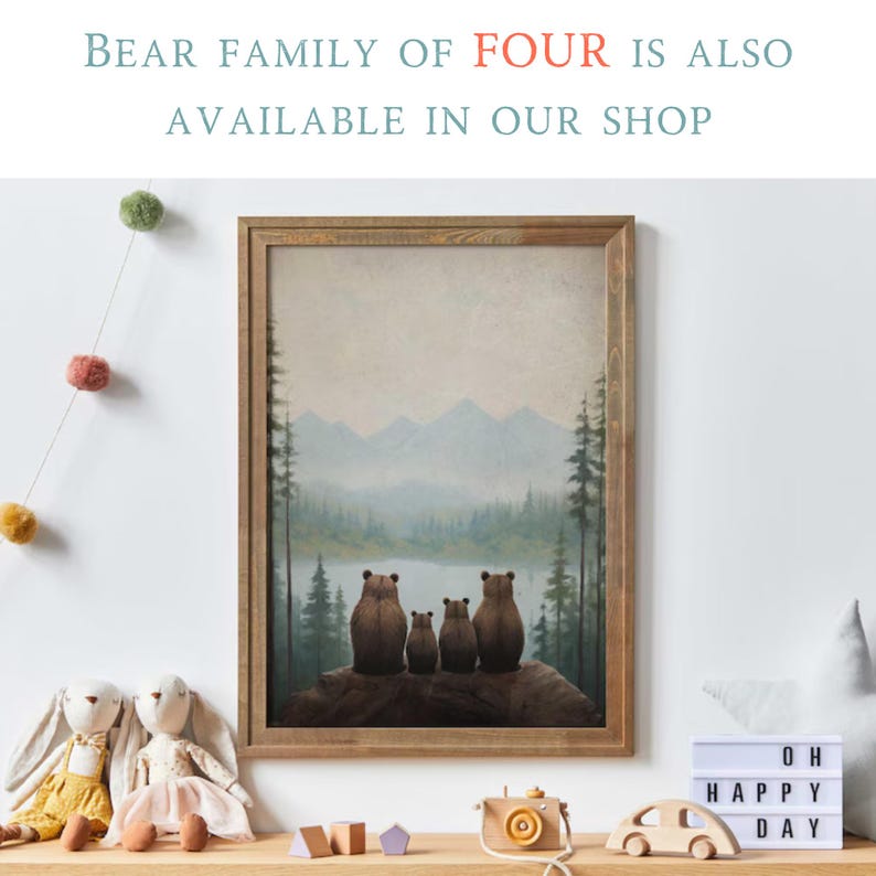 May include: A framed print of a family of four bears sitting on a log overlooking a lake and mountains. The bears are brown and the background is a soft blue and green.