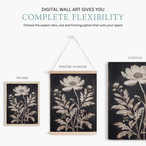 May include: A black and white botanical print of a flower with leaves on a dark wood background. The print is shown in three different framing options: a frame, a poster hanger, and a canvas.