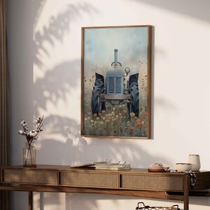May include: A vintage blue tractor sits in a field of wildflowers. The tractor is facing the viewer and has a faded blue paint job. The wildflowers are in shades of pink, purple, and white.
