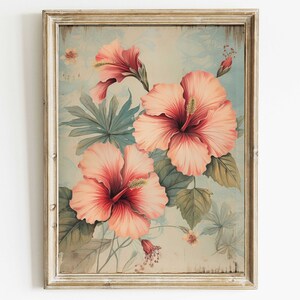 May include: A framed vintage botanical print featuring pink hibiscus flowers with green leaves on a light blue background.