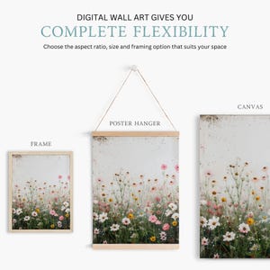May include: A digital wall art print featuring a field of wildflowers in shades of pink, white, and yellow. The print is shown in three different framing options: a frame, a poster hanger, and a canvas.