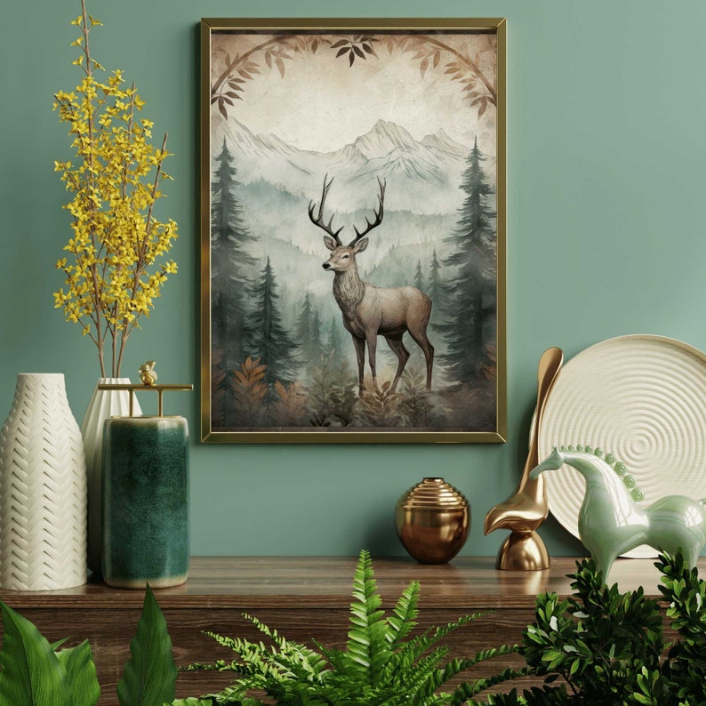 May include: A watercolor painting of a deer standing in a forest with mountains in the background. The deer is brown with large antlers. The forest is green and the mountains are blue and white.