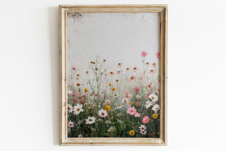May include: A framed print of a field of pink, white, and yellow wildflowers. The flowers are in a soft focus, creating a dreamy and romantic feel.