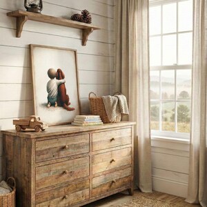 May include: A rustic wooden dresser with six drawers, a framed print of a child hugging a dog, and a wooden toy truck. A woven basket, books, and a blanket are on top. The room has a window with sheer curtains.
